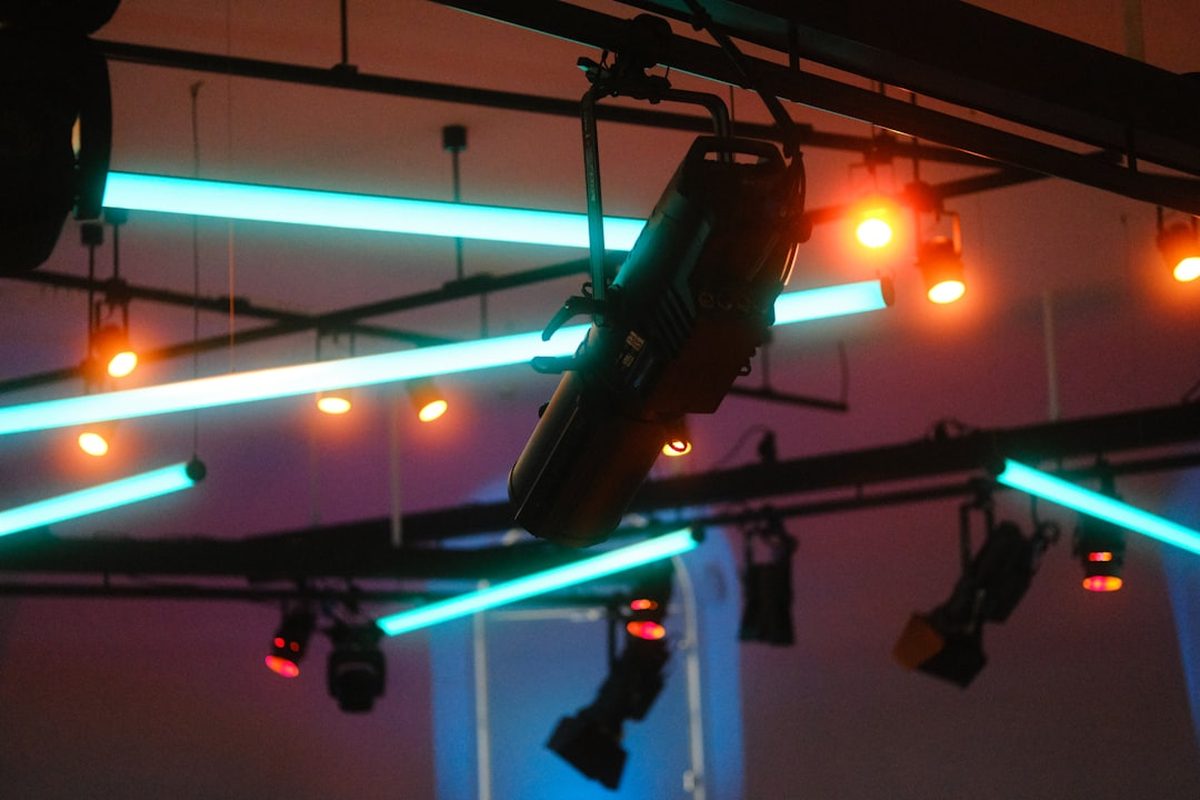 Stage lighting rig being focused during event setup