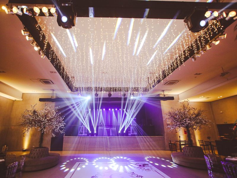 Product launch hall with string lights and stage beams